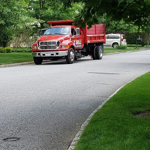 Custom yard cleanup service in Kings Park, NY by Varello Landscaping