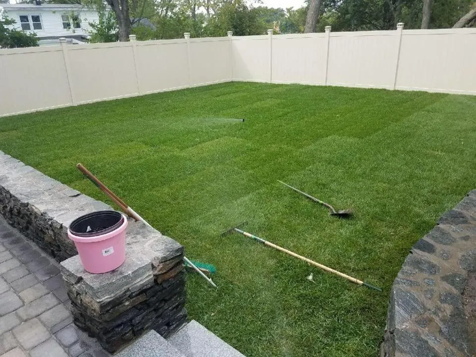 Custom landscape design for year-round maintenance in Everett, MA by Vasquez Landscaping