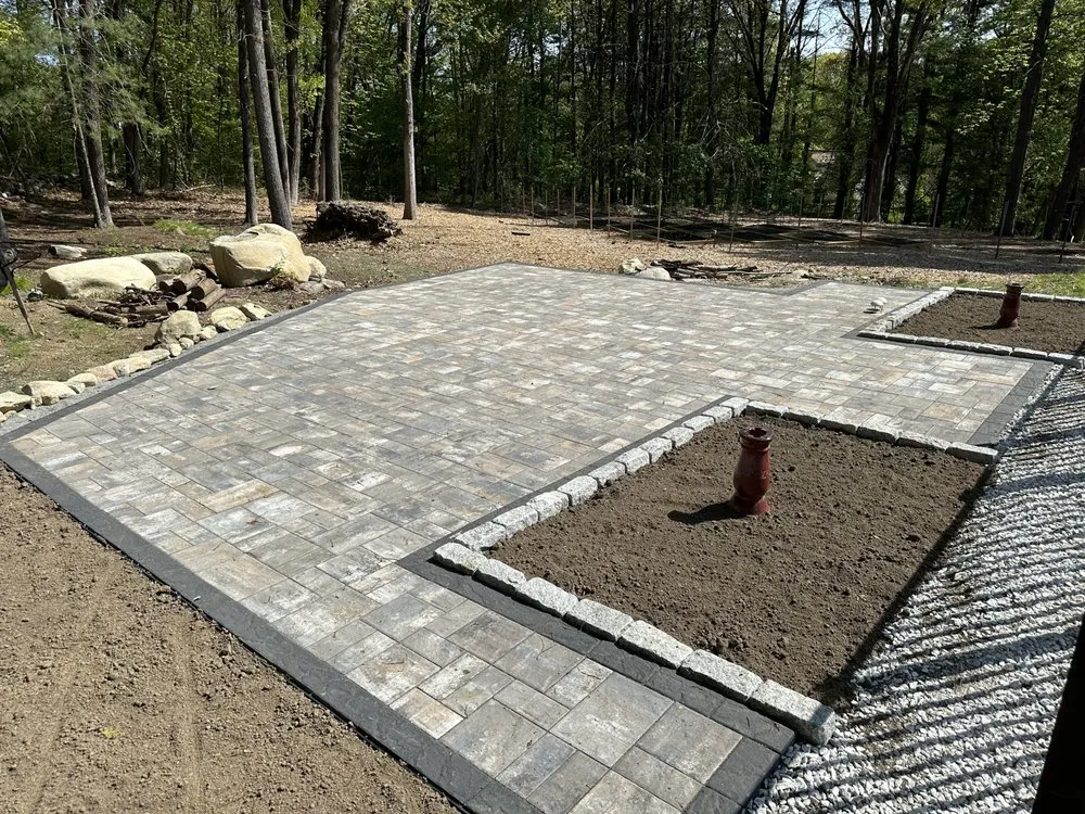 Custom outdoor landscaping with custom design across Marlborough, MA - Vega Landscape And Construction