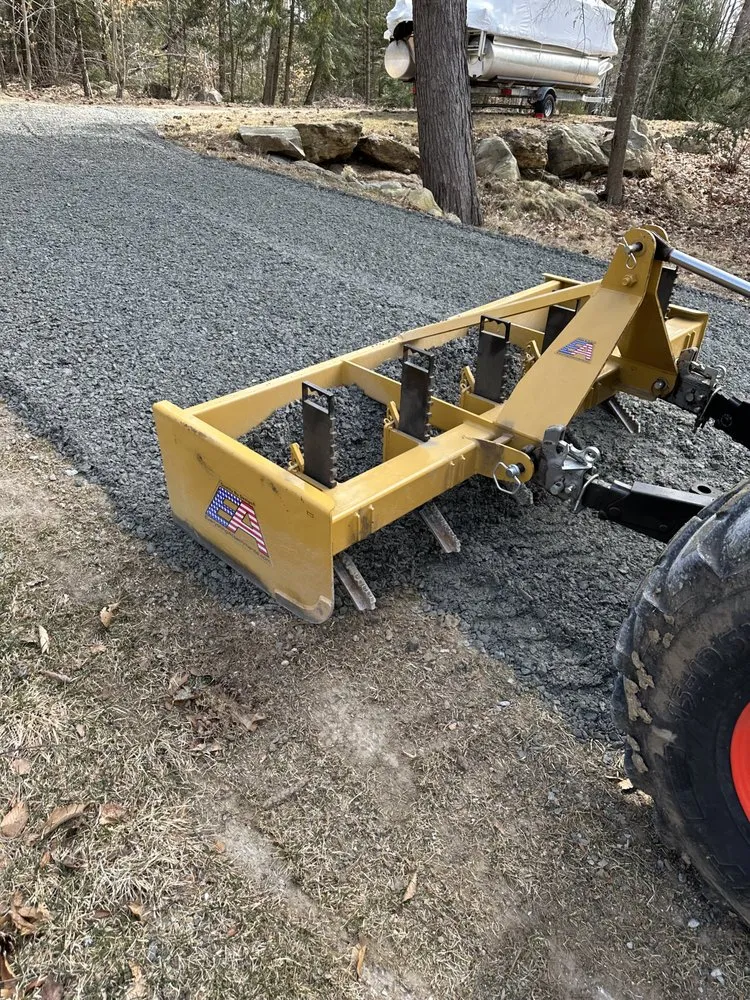 Local yard maintenance with custom design across Fitchburg, MA - Veteran Compact Tractor Service