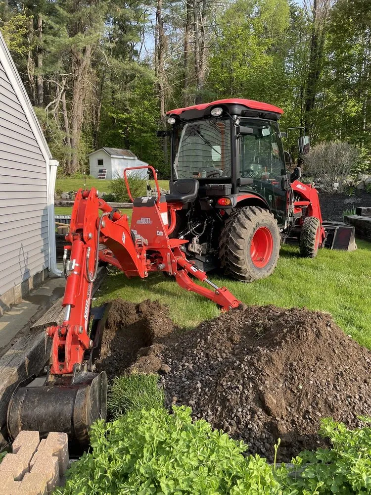Professional yard maintenance for residential properties across Fitchburg, MA - Veteran Compact Tractor Service