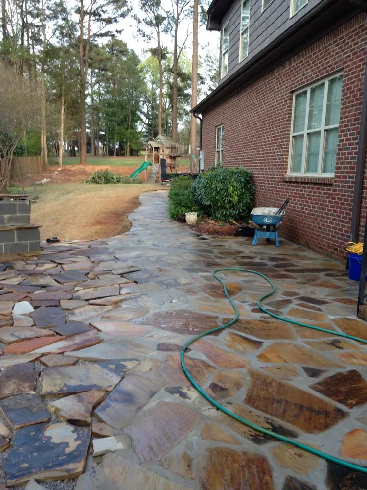 Custom landscape installation for year-round maintenance in Decatur, AL by V&H Tree Service & Hernandez Landscaping