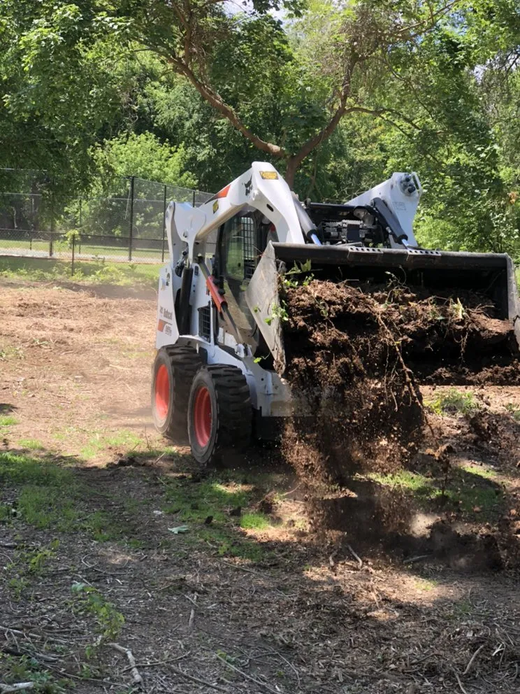 Affordable garden landscaping with custom design in Brentwood, NY by Victorio Tree Service & Landscaping