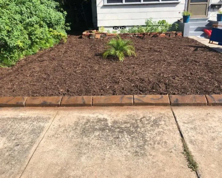 Custom outdoor landscaping with custom design in Port Orange, FL by Visual Impact Curbing