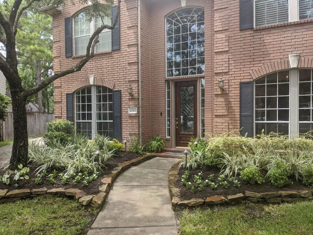 Custom residential landscaping with custom design in Cypress, TX by Water Baron Irrigation