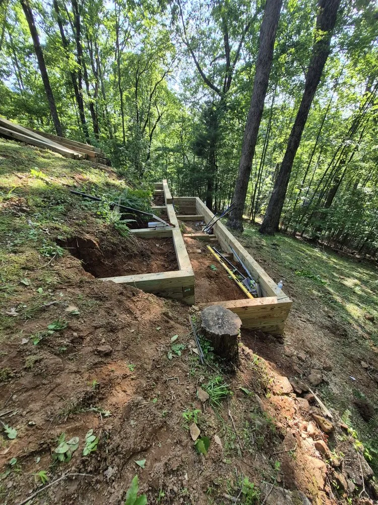 Custom landscape installation for year-round maintenance in Franklin, NC by Waterfalls Painting And Landscaping