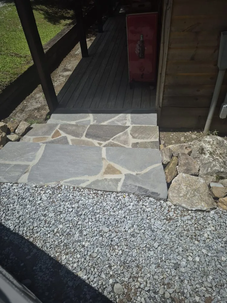 Custom lawn mowing service for outdoor upgrades in Franklin, NC by Waterfalls Painting And Landscaping