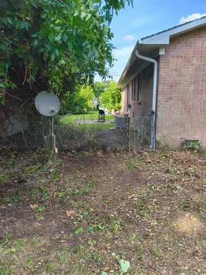 We Keep It Pushing Lawn Care Logo