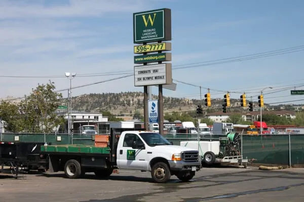 Weisburg Landscape Maintenance Logo