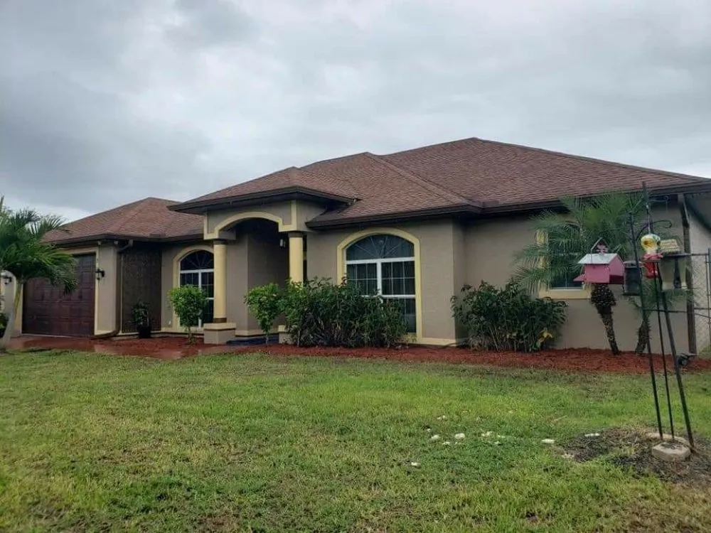 Professional landscape installation for residential properties in Lehigh Acres, FL by Wess Lawn Care Services