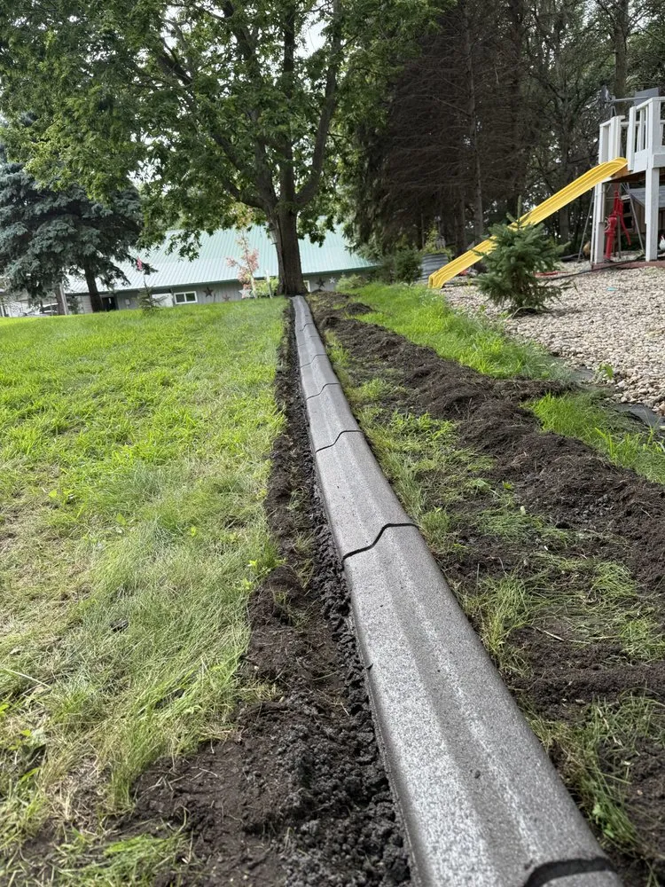 Professional lawn mowing service for residential properties in Barrett, MN by West Central Decorative Curbing