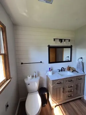 Whalens Construction and Lawn Care Logo