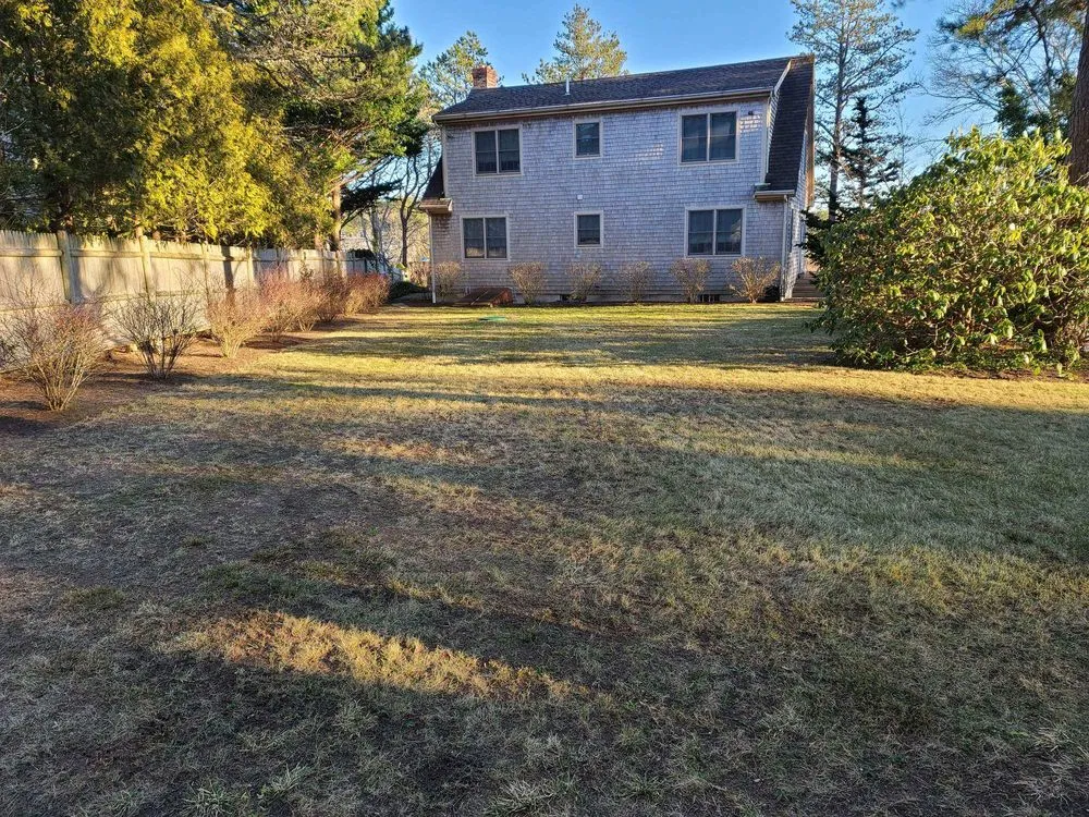 Professional lawn care service for residential properties in Sagamore Beach, MA by White Cap Landscape