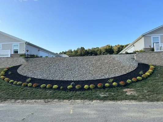 Whitmer's Lawncare and Landscape Logo