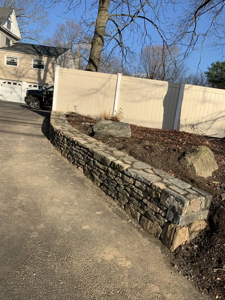 Professional lawn mowing service for homes in Bethel, CT by Willis Landscaper & Masonry