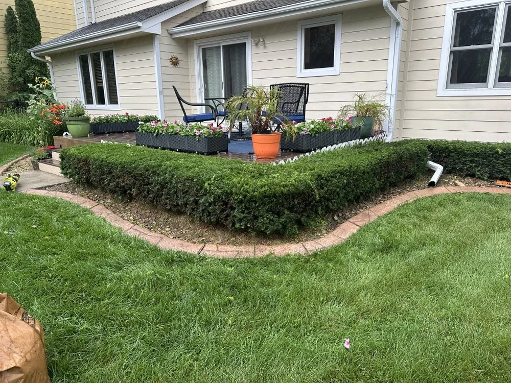 Custom landscape installation in Johnston, IA - Wilson’s Hedge & Bush Trimming