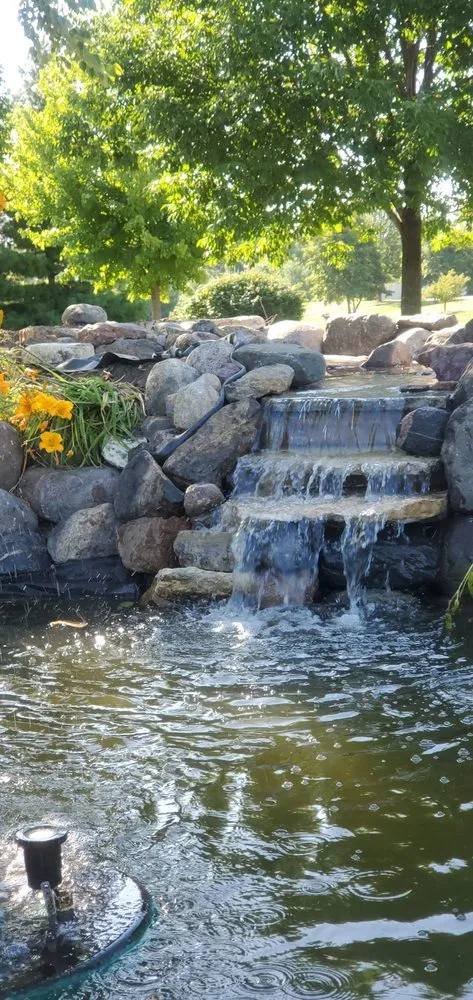 Local landscape installation with custom design in Granger, IA by Windy Acre Water