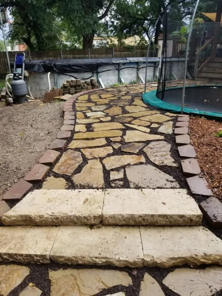 Affordable yard maintenance for homes in Wichita, KS by Winsor landscapes