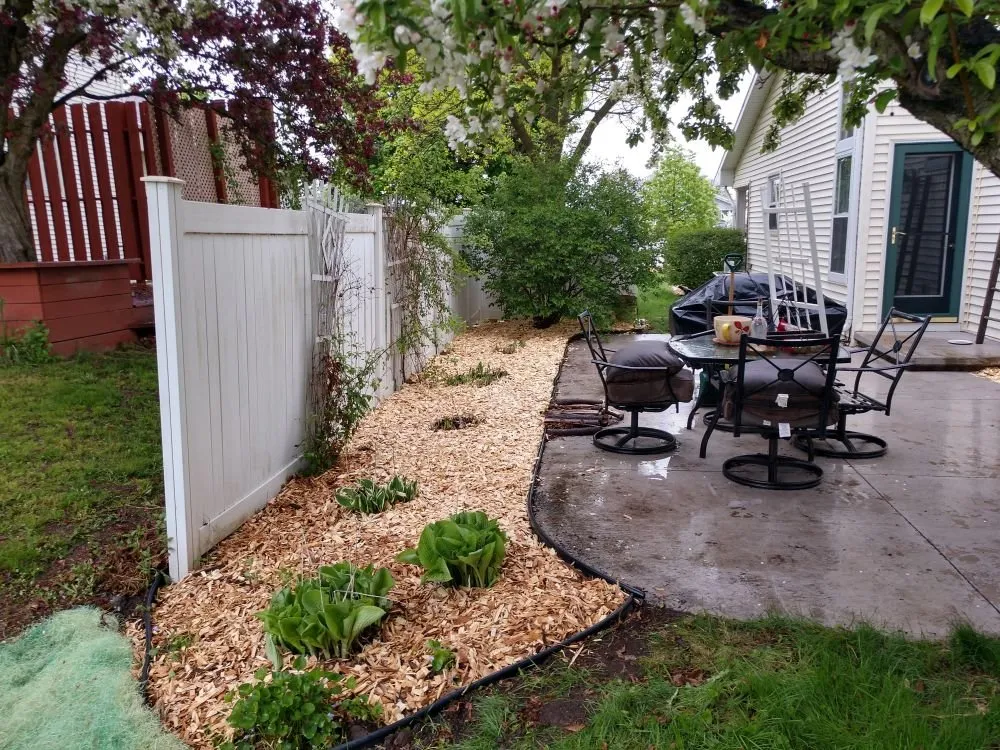 Custom garden landscaping with custom design in Shiocton, WI by Wisconsin Maintenance Company