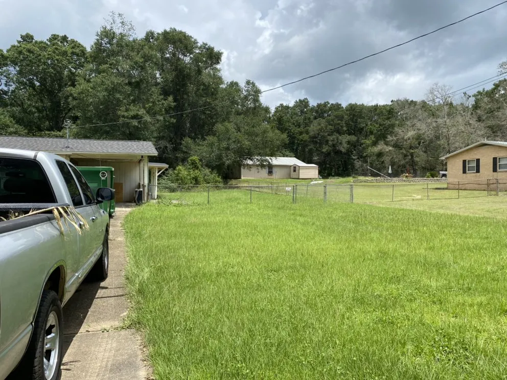 Affordable landscape design in Pace, FL by Wisemen Tree Company