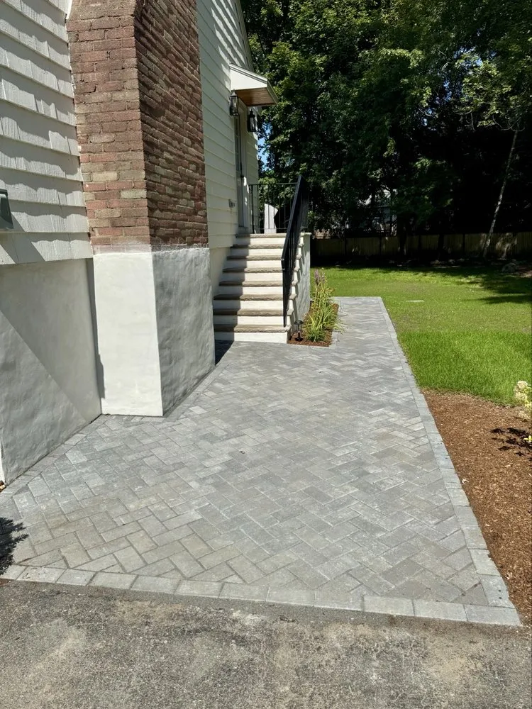 Professional yard cleanup service for outdoor upgrades across Belmont, MA - Wollaston Development