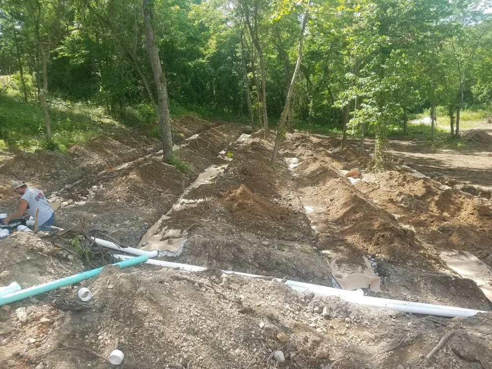 Reliable landscaping services for residential properties in Rogersville, MO by Wooden Creations Landscape Construction & Septic Service