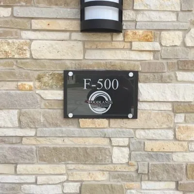 Woodlands Exterior Designs Logo