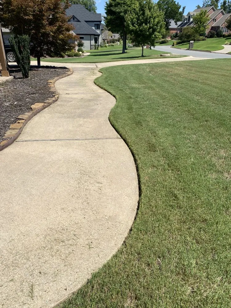 Custom landscape design for beautiful yards in Tull, AR by Woodsmen Lawn Care