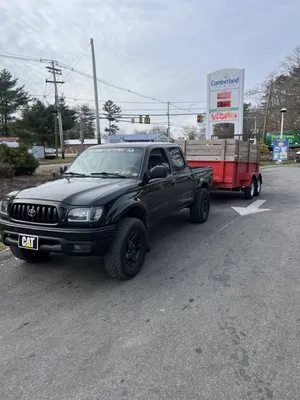 Woody’s Landscape Logo