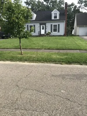 Woodys Lawn Service Logo