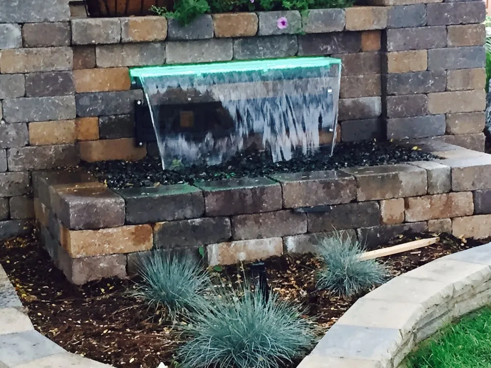 Custom landscaping services for year-round maintenance in Arvada, CO by Woody's Lawn Sprinkler & Landscape