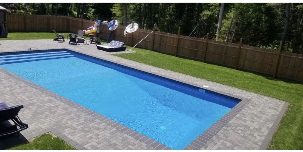 Professional lawn mowing service in Plymouth, MA by Xtreme Living Pools and Construction