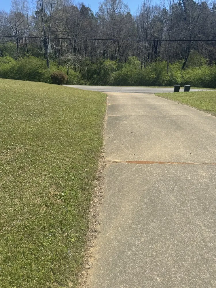 Professional lawn mowing service for residential properties in Adger, AL by Yacks