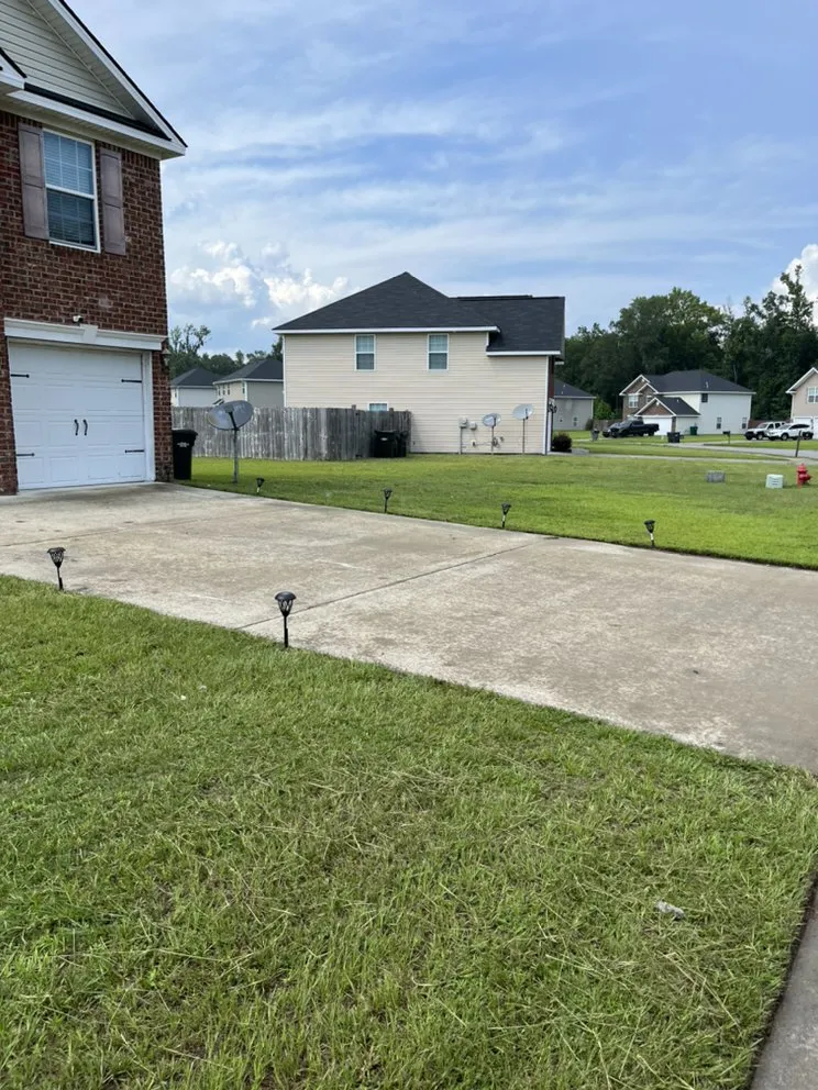 Affordable yard cleanup service for homes in Fort Stewart, GA by Yah’s Everything