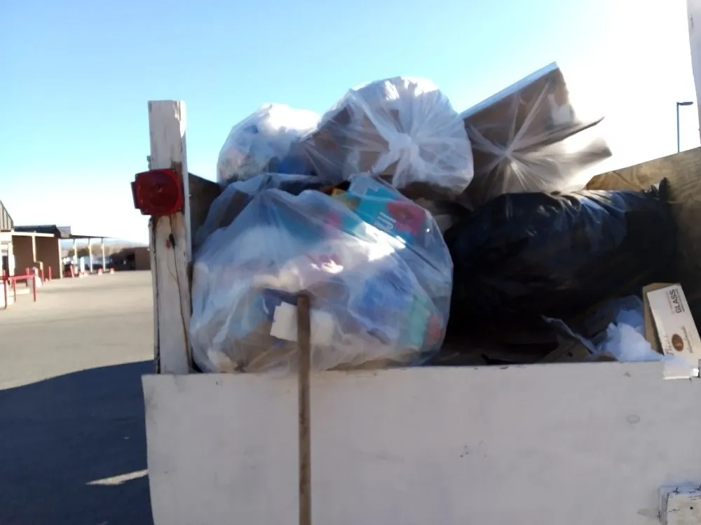 Affordable lawn care service for residential properties in Las Vegas, NM by yard cleaning hauling loading & dumping