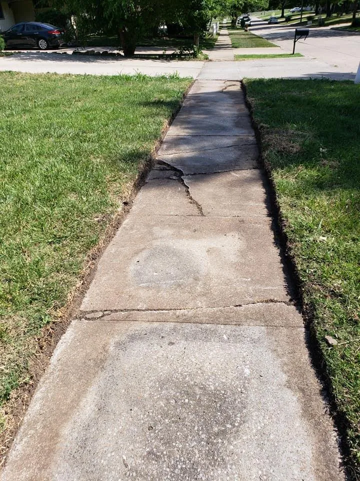 Expert yard cleanup service for year-round maintenance in Topeka, KS by Yard Crafters