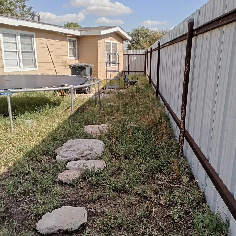 Custom landscape installation for residential properties in Odessa, TX by Yard work by DP