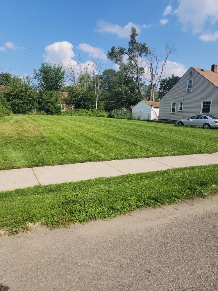 Expert lawn mowing service for residential properties in Detroit, MI by Yardman Landscaping