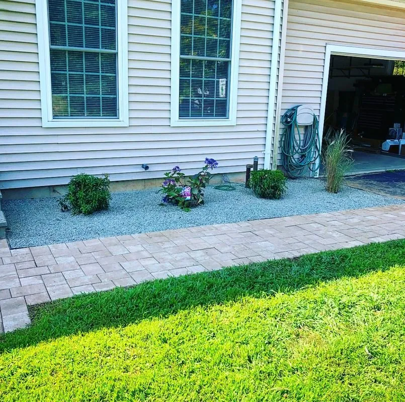 Affordable lawn care service for outdoor upgrades in Hartford, CT by Yello Landscaping