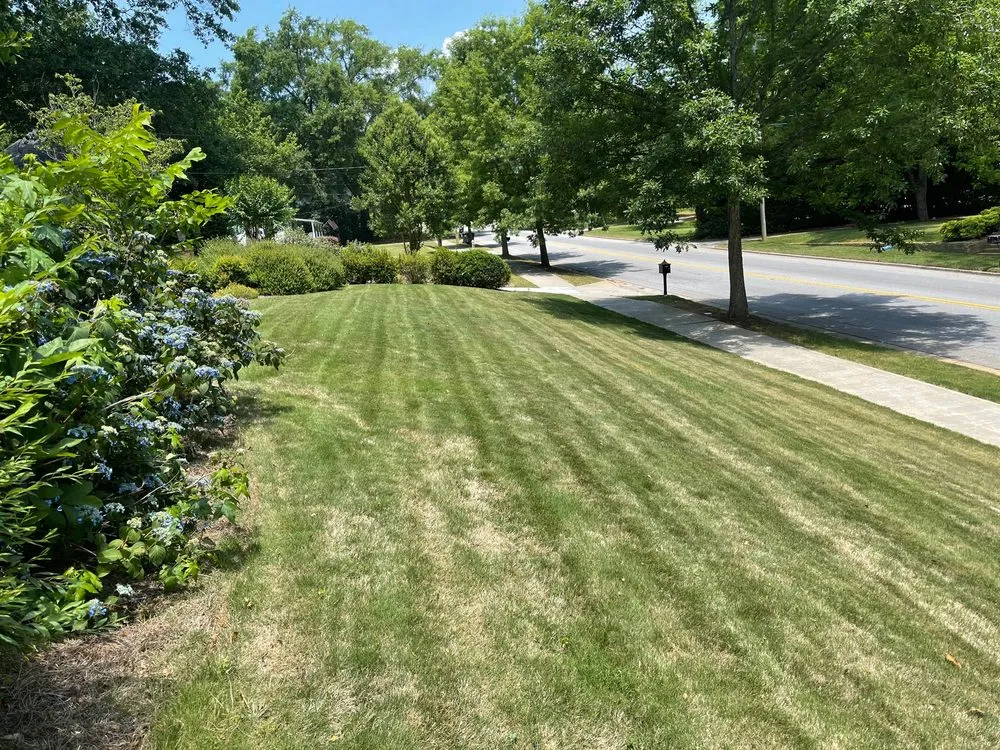 Reliable lawn mowing service for year-round maintenance in Covington, GA by Yellow River Landscaping