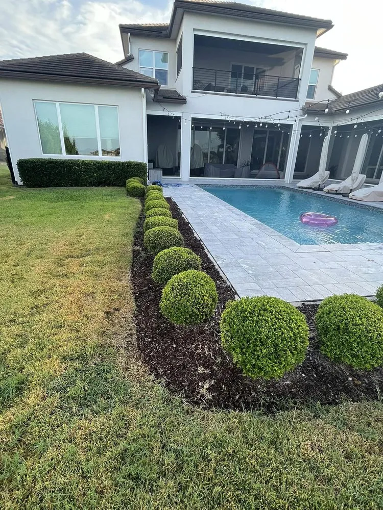 Trusted yard maintenance with custom design in Pine Hills, FL by Yes We Can Landscaping