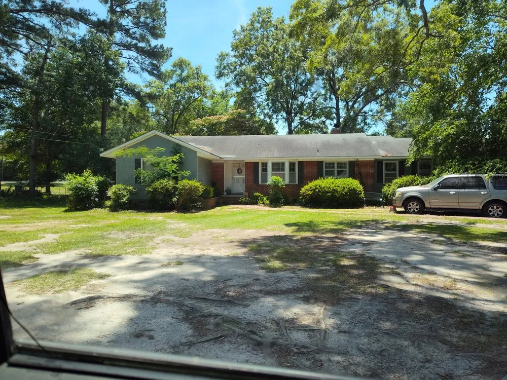 Professional landscape design for homes in McColl, SC by You Call We Haul