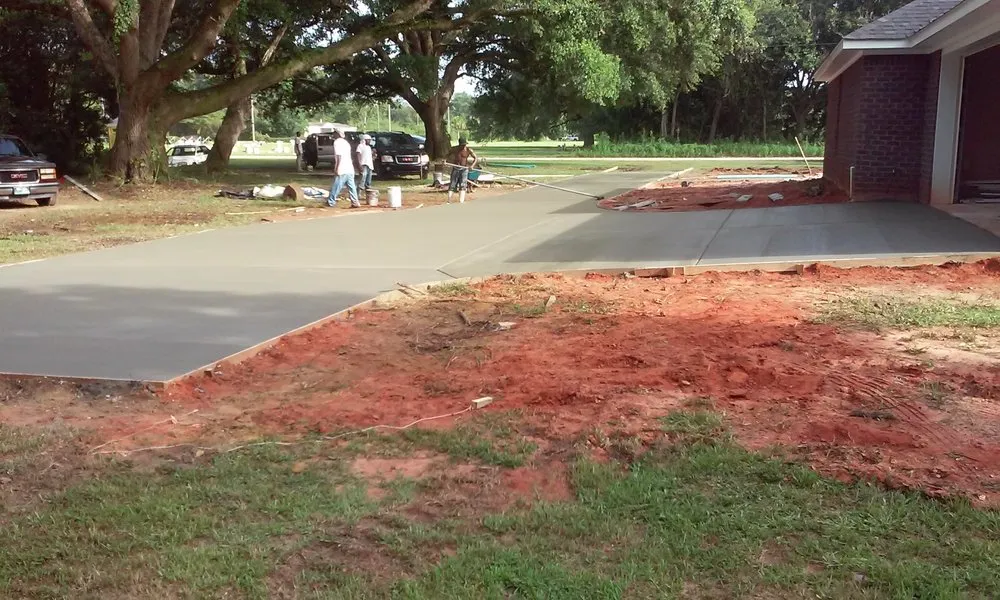 Reliable lawn mowing service for outdoor upgrades across Mobile, AL - Young Guns Construction