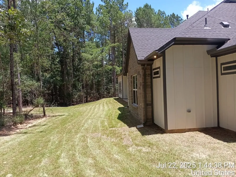 Professional landscape installation in Conroe, TX by Your Ditch Is Ugly