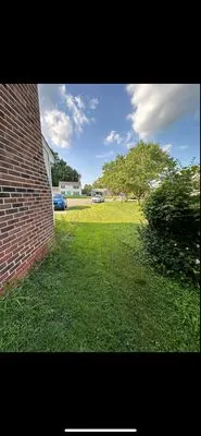 Zahi Cares Lawn Service Logo