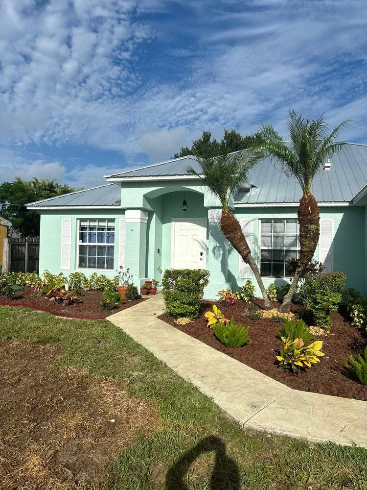 Reliable lawn mowing service for residential properties in Stuart, FL by Zaza & Iris Landscaping